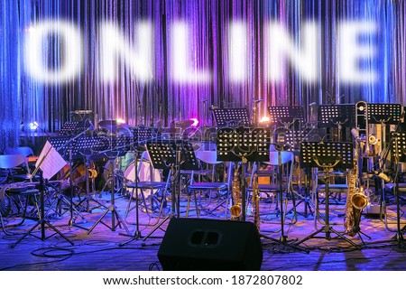 Watch Online Concert. Online Event During Coronavirus Pandemic Covid-19. Word Online on Stage Background. Music Festival. Show on Quarantine. New Normal. Inscription Online on Illuminated Empty Stage Royalty-Free Stock Photo #1872807802