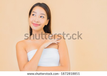 Portrait beautiful young asian woman with beauty spa cosmetic makeup concept on color isolated background