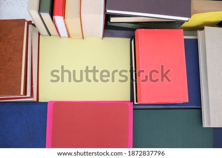 Books on the table with yellow space for text advertisements or notices