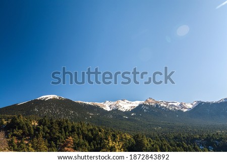 Landscape picture showing a Aroania (Chelmos) mountains area covered with snow near Kalavrita, Greece with blue sky for background. Aroania (Chelmos) Mountains peak with snow in Greek countryside