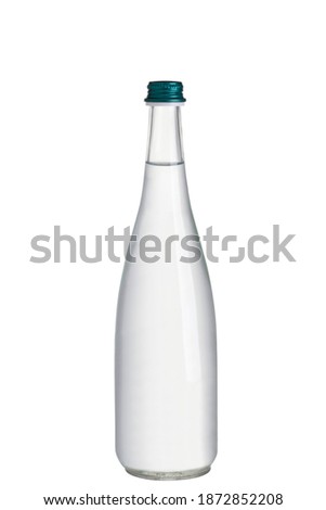 Glass bottle filled with water in front of a white background. Glass bottle with green cap drawn in front of the endless background. recycling and healthy lifestyle concept.