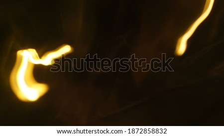 Light Bokeh Trail Abstract Long Exposure Art Horizontal Background for Futuristic, Fancy, Fantastic Concept Designs with Copy Space. Blurred Motion Defocused Photo Overlay Gold and Blue Texture. 