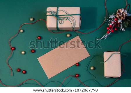 Gift boxes on a green background. A set for packing boxes, packing of gifts for Christmas, Valentine's Day, Birthday. Christmas flatlay. Beautiful gifts for Christmas with decor on gren background.