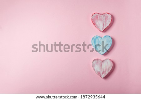 Valentine hearts made of paper mache. Symbol of love and holiday Valentine's Day. Minimalism concept, template for congratulations. Top view, place for text.