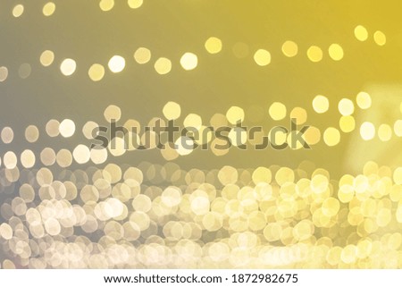 Christmas bokeh background lights. Colors of the year 2021- yellow and ultimate gray.
