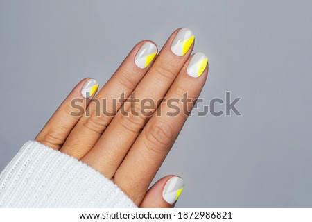 Perfect minimalistic manicure with geometry in trendy colors of year 2021.