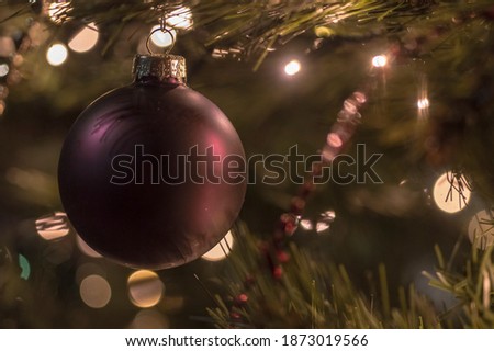 Close up picture of a purple Christmas ornament