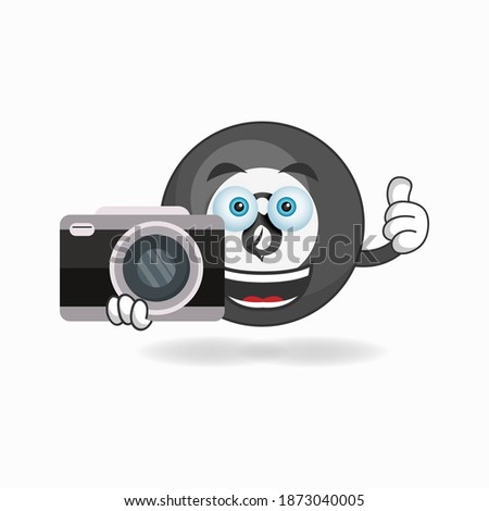 Billiard ball mascot character holding camera. vector illustration