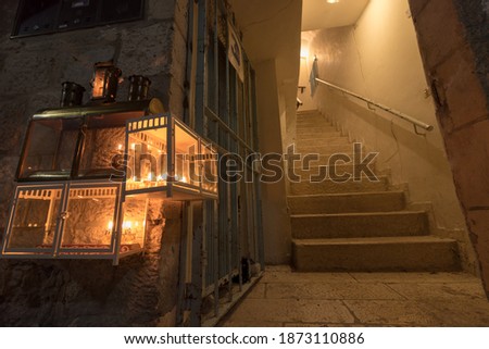 Menorahs are lit at the entrance to a house in the Jewish Quarter of the Old City of Jerusalem, Israel