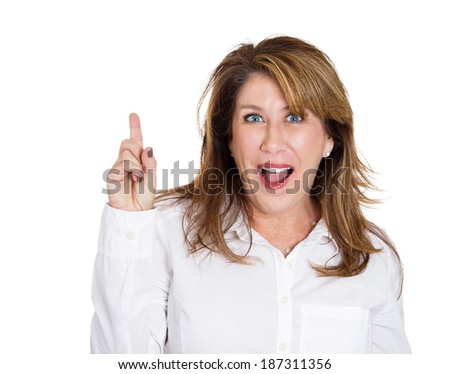 Closeup portrait intelligent excited mature woman who just came up with idea aha, pointing up, number one sign, isolated white background. Positive human emotion, facial expression feeling, attitude