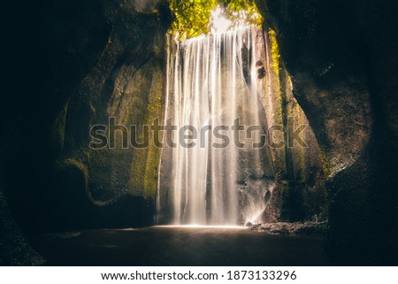 Waterfall in nature. Nice long exposure of a waterfall, a river cascading down a rock.