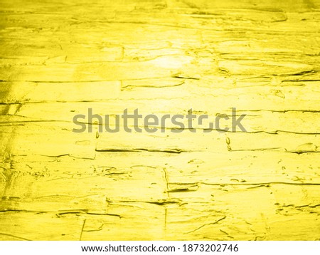 Illuminating yellow acrylic painted wooden background. Wall, road pavement effect