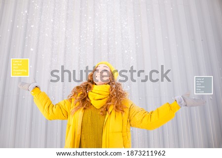Young Ginger girl wearing colors of the year 2021. Ultimate gray and illuminating yellow colors