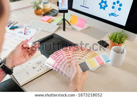 Graphic designer having online meeting with clinet when choosing best shadow of pink color for company logo