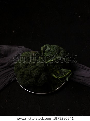 Broccoli on a plate. Dark moody food photography. Still life photography.