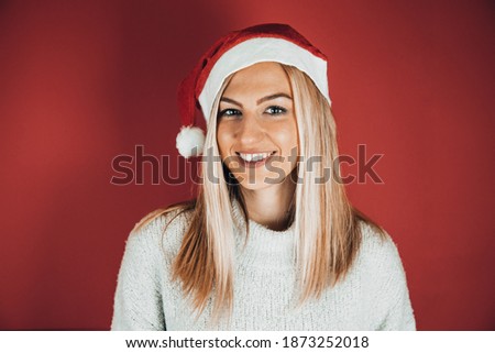 Attractive smiling woman preparing Christmas gifts for friends and family. New Year concept.