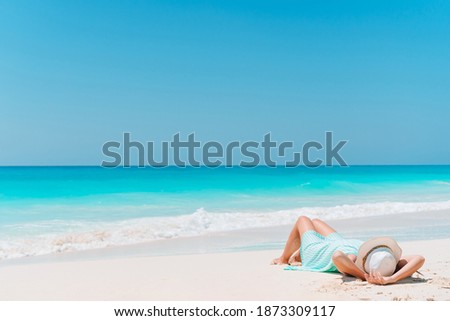 Young beautiful woman relaxing on the beach