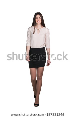 Successful business woman walking - isolated over white