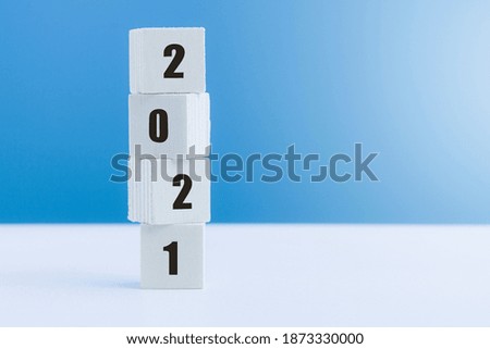 Vertical wooden cube with number 2021, start up for New Year 2021, Happy New Year changing year.