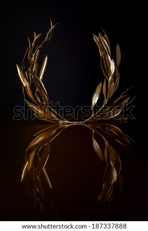 Golden Olive Wreath on dark background