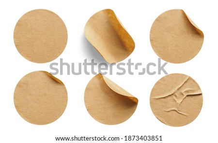 Brown round paper sticker label isolated on white background