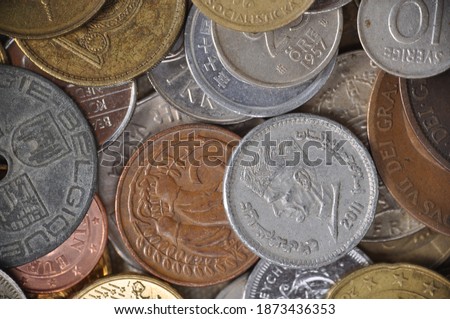 Macro close up different coins money of the world. Many countries. a bunch of coins. Numismatics.
