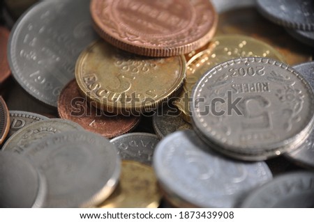 Macro close up different coins money of the world. Many countries. a bunch of coins. Numismatics India and Portugal