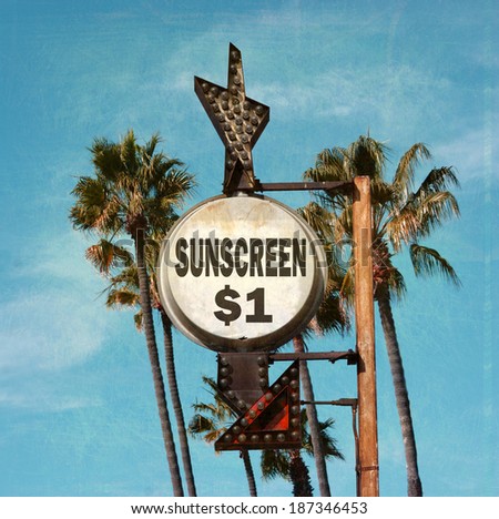 aged and worn vintage photo of sunscreen beach sign