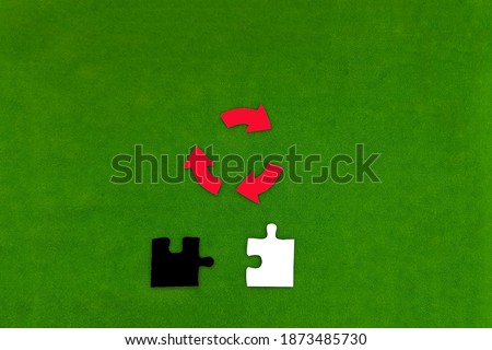 Sign processing of red, two of the puzzle in black and white on a green background. Concept of waste processing, collection, connection.