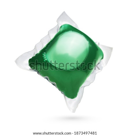 Laundry detergent pod, green colored isolated on white background