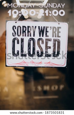 Sorry we're closed sign hanging on the door