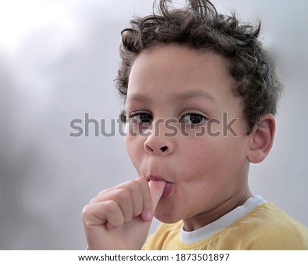 boy sucking thumb on white background with people stock image stock photo
