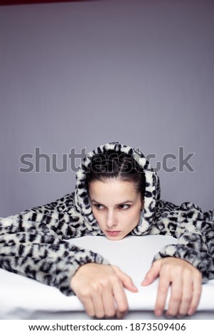 art portrait of a woman in a toast with a hood