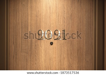 Happy New Year 2021 concept, lettering on the Hotel door. Royalty-Free Stock Photo #1873517536