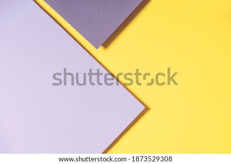 Abstract geometric paper background in yellow and gray colors. Trendy illuminating yellow and ultimate gray colours background