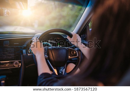 Asian woman buying or renting rental new car owner car key hand shake from sales seller, taking and passing driving license examination test happy cheerful smiling excited salesman sold car dealership