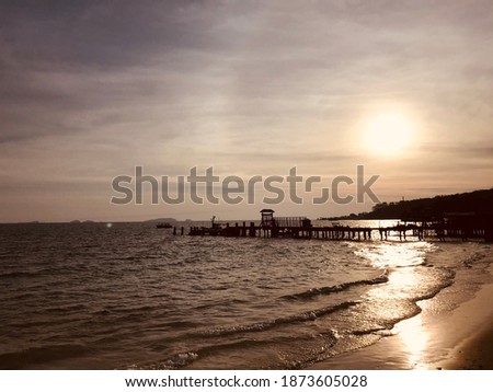 The pictures of the beach and the sea as the sun is about to set, giving a feeling of tranquility.