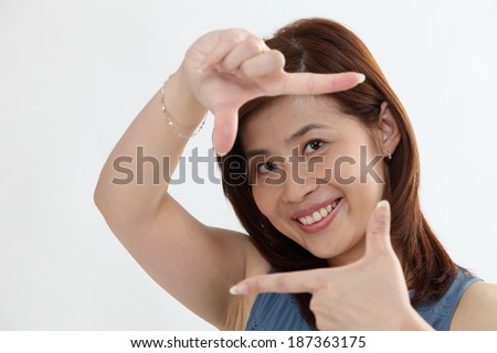 woman using her hands to create a border around her face
