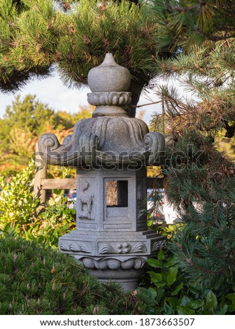Details of Japanese style stone pagoda in the garden. Travel photo, street view.