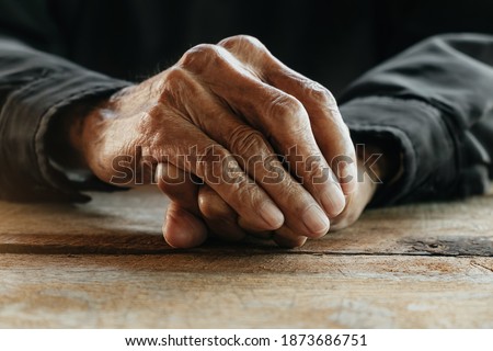 Close up of male wrinkled hands, old man is wearing
 Royalty-Free Stock Photo #1873686751
