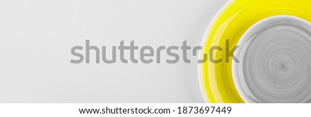 Illuminating and Ultimate gray color of the year 2021. Two plate on background. Food, kitchen, recipe concept. Top view, copy space. Banner for website
