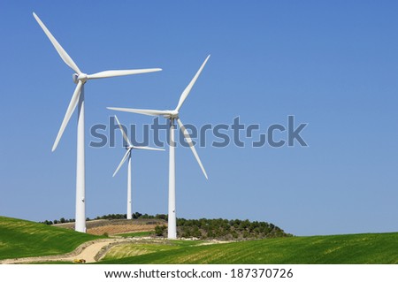group of windmills for renewable electric energy production Royalty-Free Stock Photo #187370726