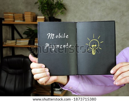 Business concept meaning Mobile Payments with sign on the page.

