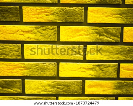 Background from a yellow brick wall. presentation of fashion colors 2021