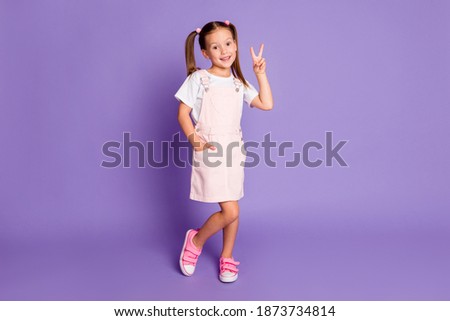 Full length photo of nice pretty schoolgirl make v-sign good mood isolated on purple color background