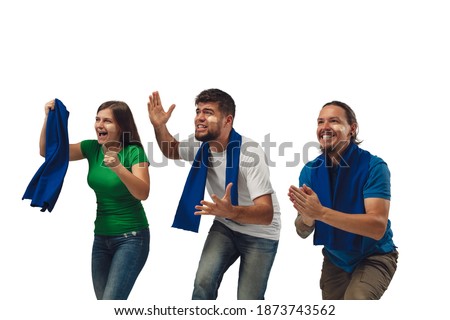 Drive. Three soccer fans woman and men cheering for favourite sport team with bright emotions isolated on white studio background. Looking excited, supporting. Concept of sport, fun, support.