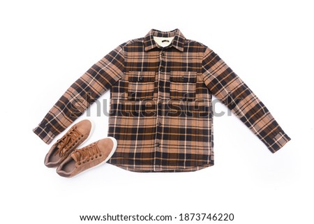 long sleeve colorful checkered plaid shirt and brown shoes on white background

