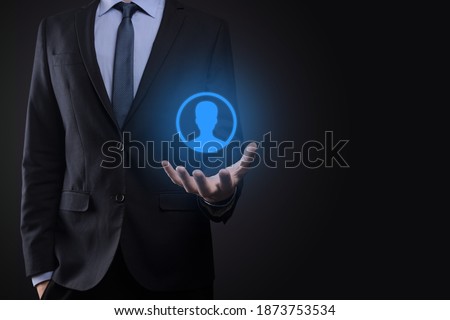 Businessman man holding shopping cart trolley mini cart in business digital payment interface.Business, commerce and shopping concept.