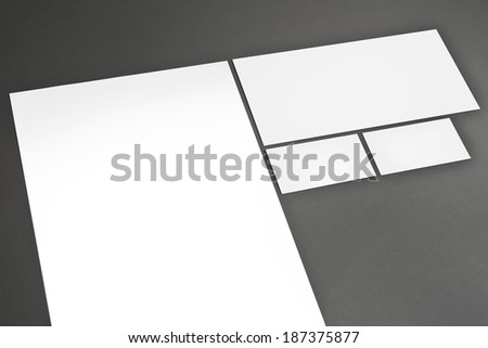Blank corporate identity package business cards envelope and letter with clear gray background.