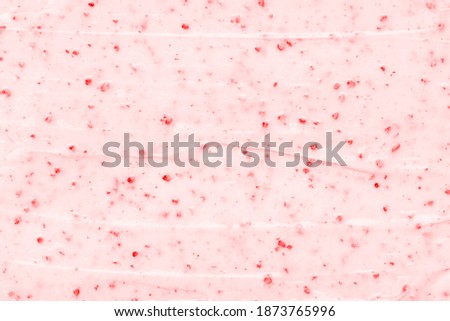 Strawberry frozen yogurt background close up. Strawberry ice cream texture close up. Top view. Pink fruit ice cream background with small pieces of berries Royalty-Free Stock Photo #1873765996